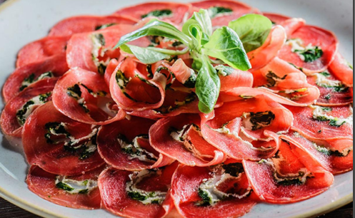Prepared slices of beef carpaccio. Sustainable and regenerative meat sourcing for nutrient dense meals.