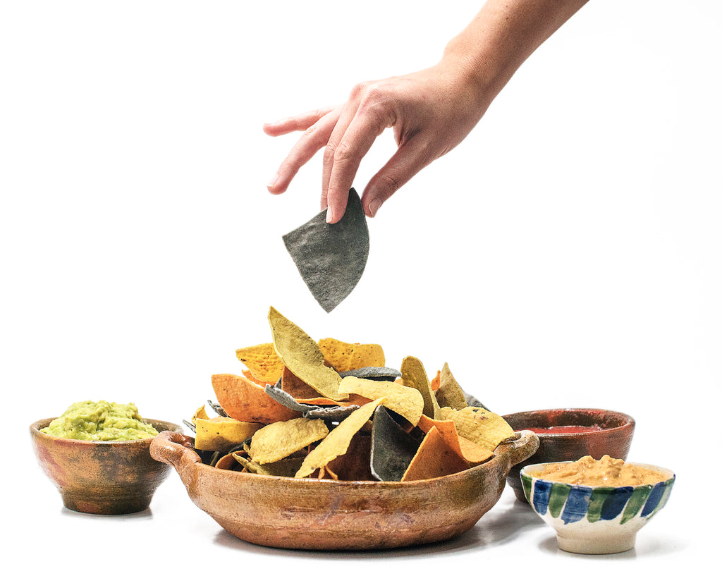Organic artisanal hand made nacho chips mix. Four flavors: Negro, Amarillo, Blanco, Chile Guaque/Cilantro.