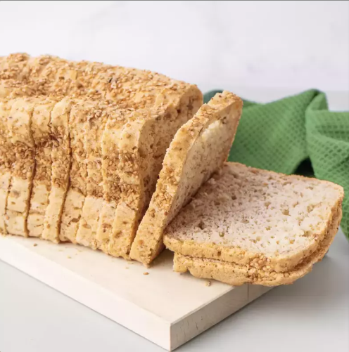 All natural gourmet gluten-free seeded bread. Artisanal loaf with rice flour, sesame, pumpkin seeds for wellness.