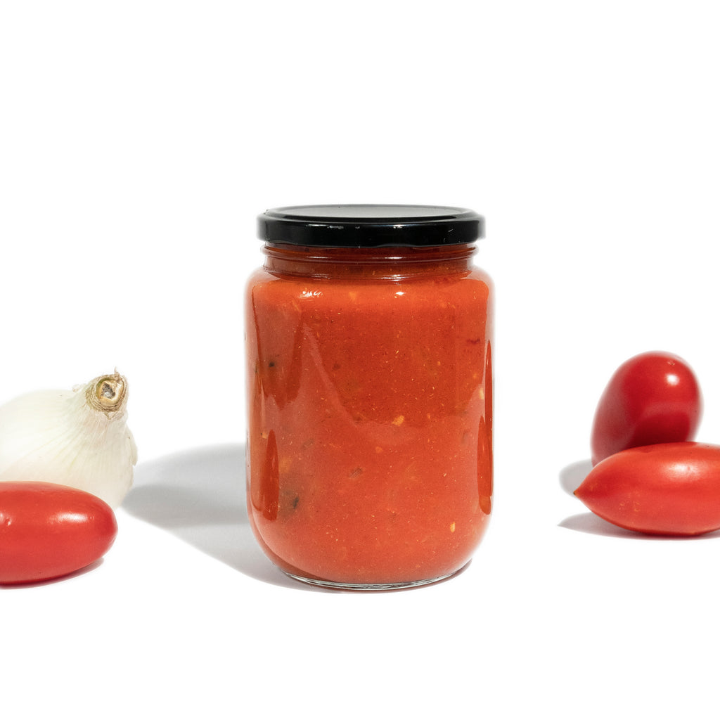 Organic artisanal hand made salsa with herbs, spices and Tomate Rojo. Clean ingredients for wellness.

