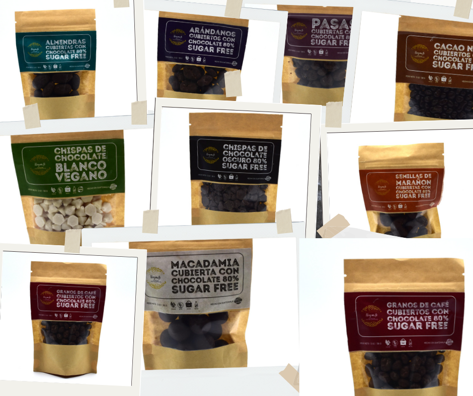 Assortment of sugar and dairy free dark chocolate covered nuts/fruits snacks. Sustainable regenerative wellness.