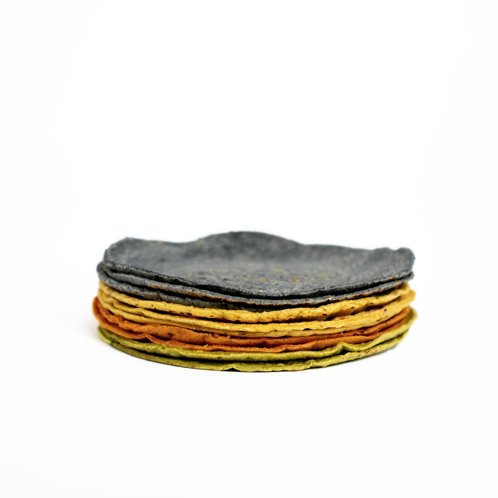 Organic artisanal hand made tortillas mix with five flavors: Negro, Amarillo, Blanco, Chile Guaque, Cilantro.