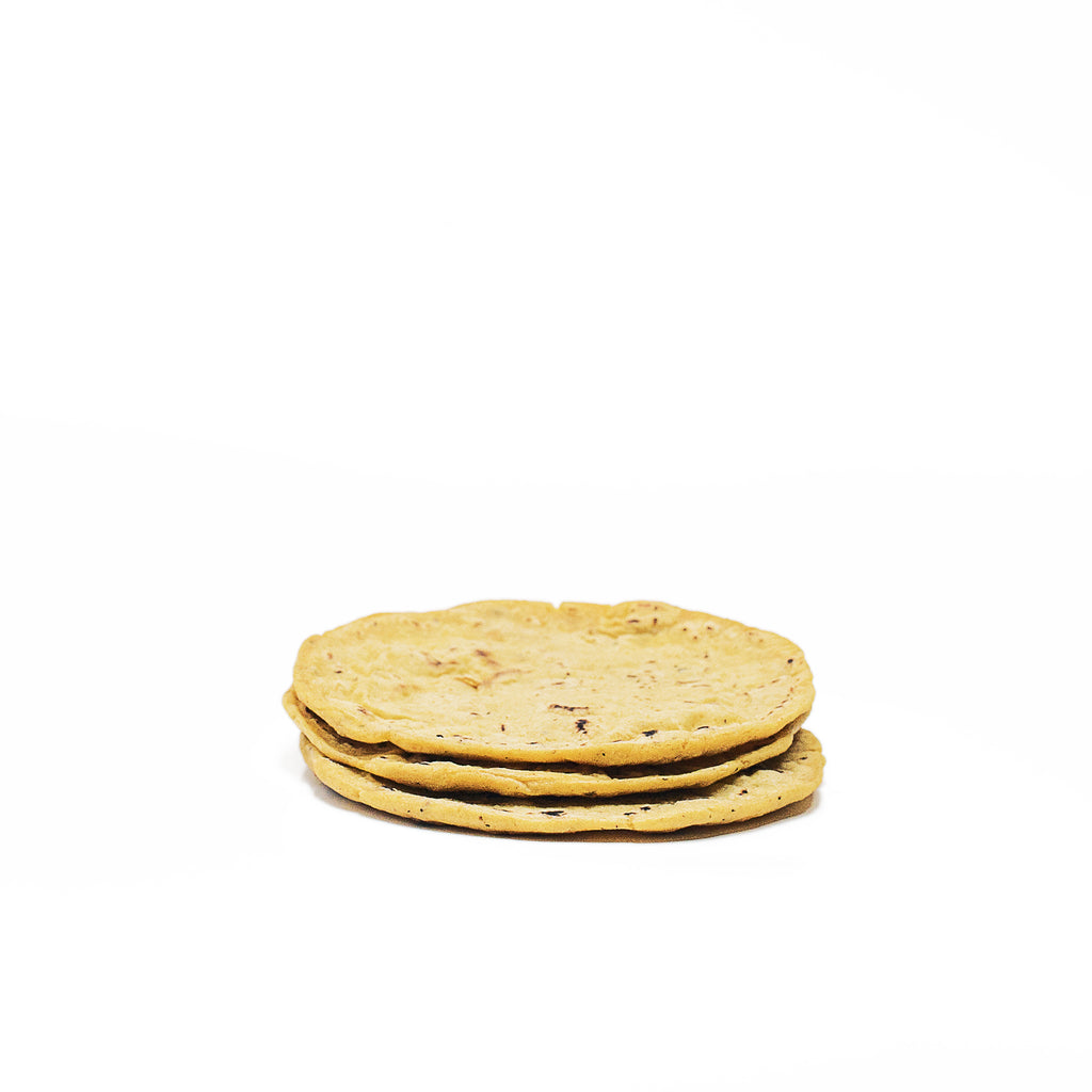 Organic artisanal hand made tortillas a mano. Maíz con Chile Guaque and Cilantro options shown.