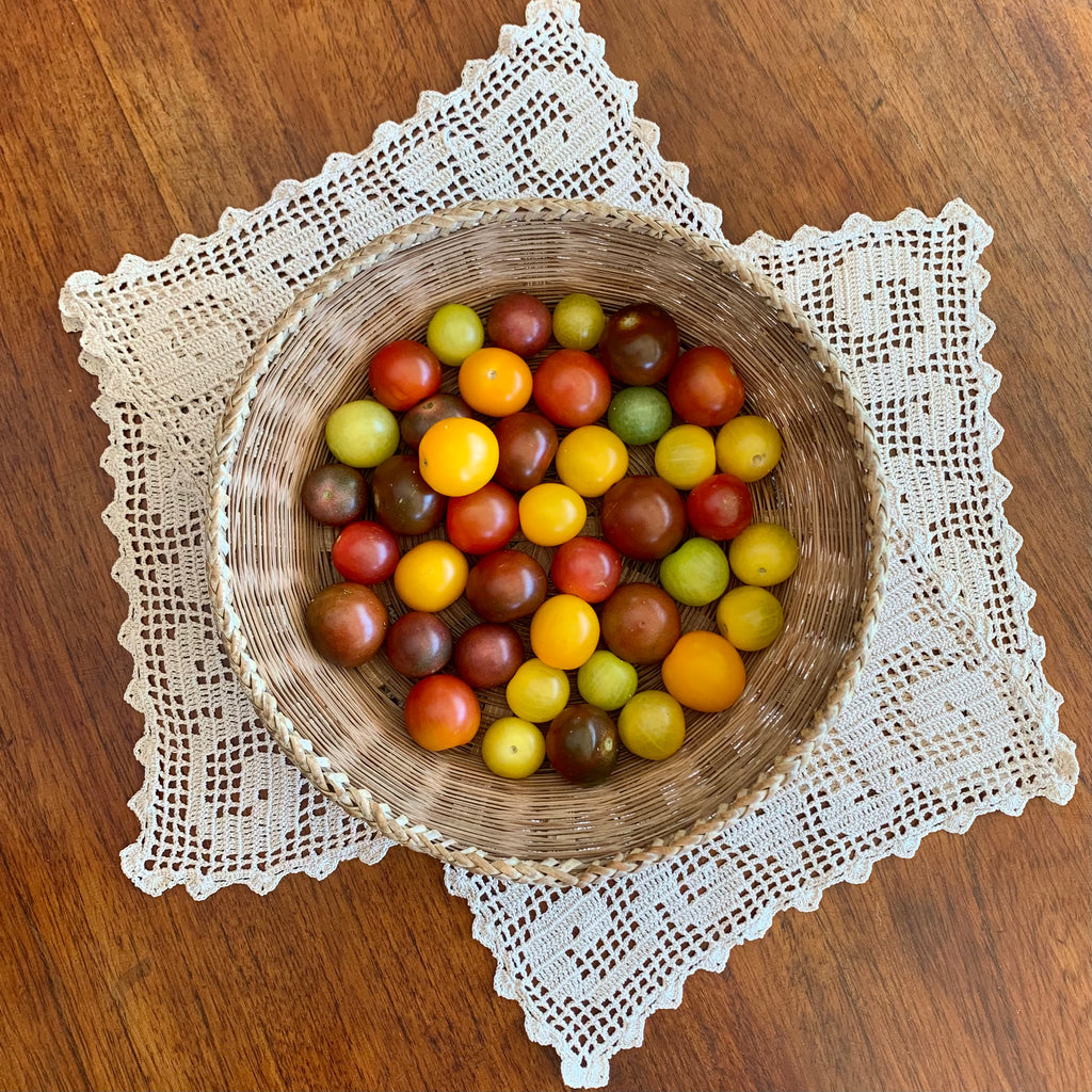 A mix of colorful organic heirloom mini tomatoes. Sustainable and regenerative cultivation for nutrient dense produce.