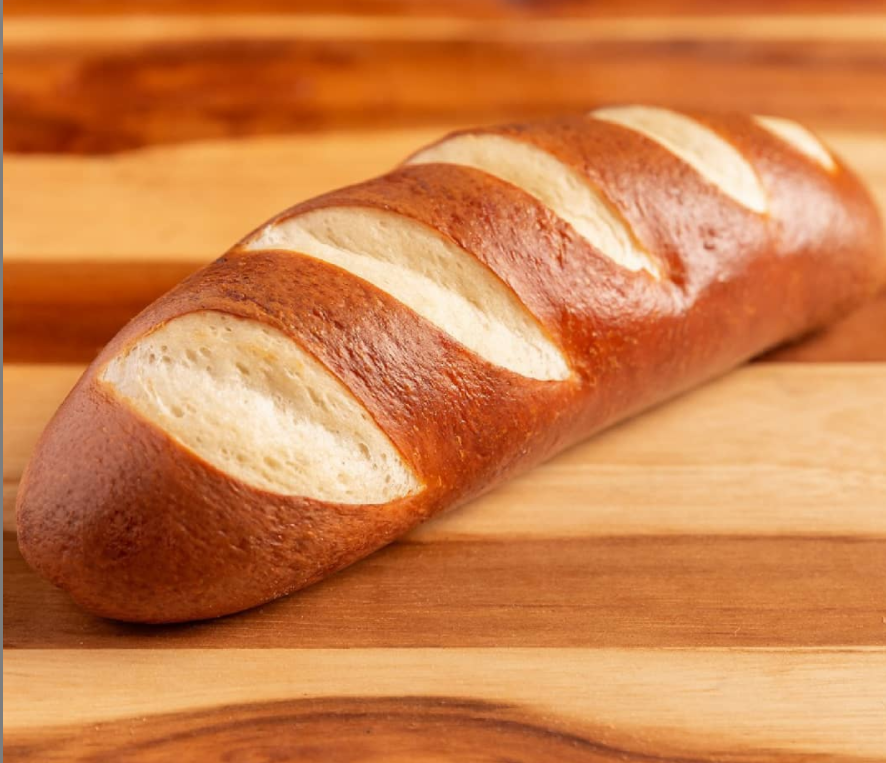 Moist, fluffy, flavorful artisanal pretzel hot dog buns by Panito, perfect for specialty sausages.