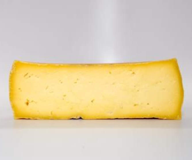 Luxurious gourmet hand crafted Pecorino caido del cielo cheese. Artisanal, semi-soft, creamy, aged for wellness.