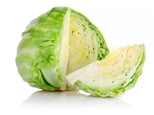Whole head of fresh "beyond organic" green cabbage. Regenerative and sustainable cultivation for nutrient dense food.