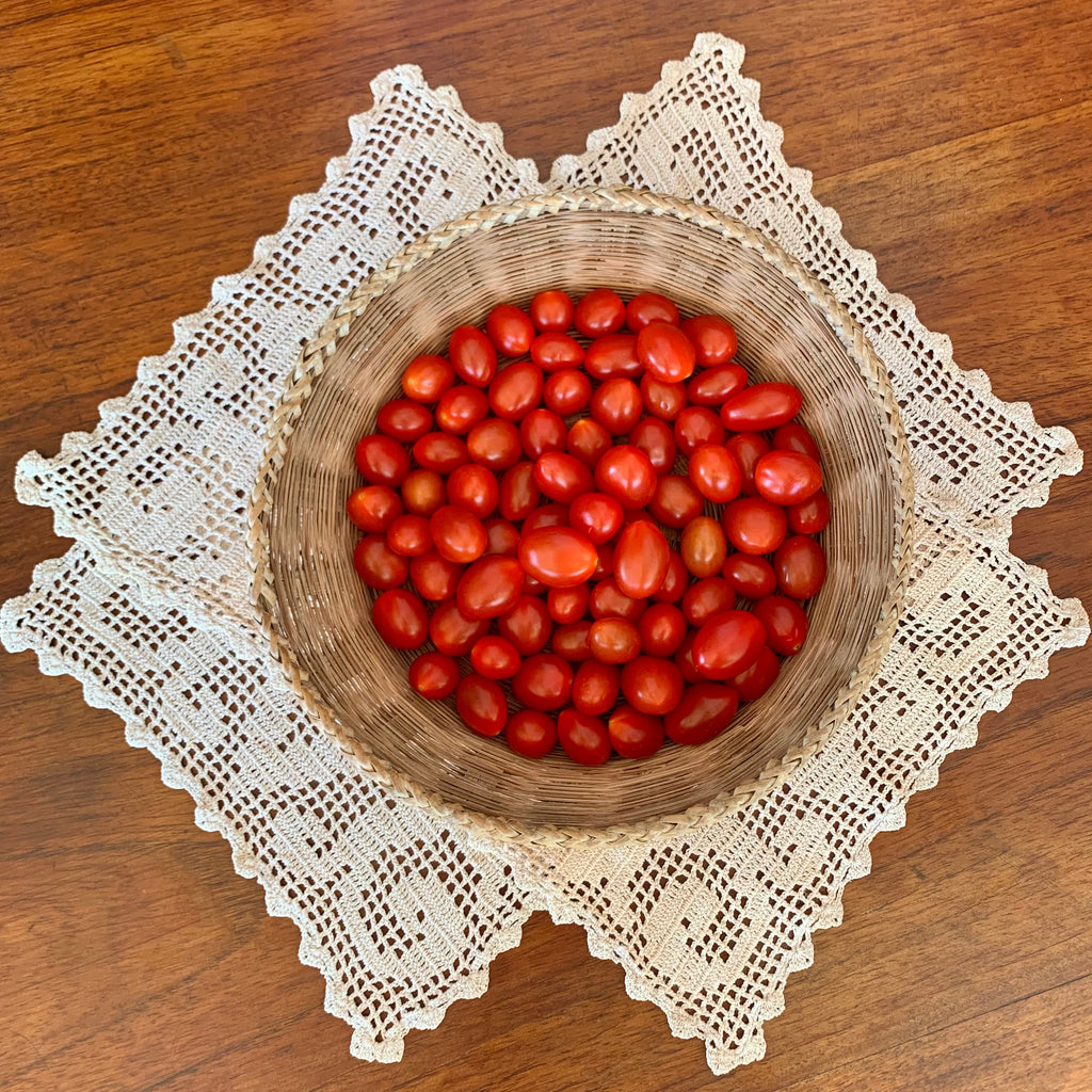 Bowl of "beyond organic" Heirloom Red Grape Tomatoes. Regenerative and sustainable for heart health and immune wellness.